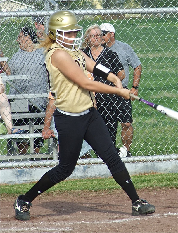 Image: Megan hits — Megan Richards(22) drills a shot thru the Frost infield.