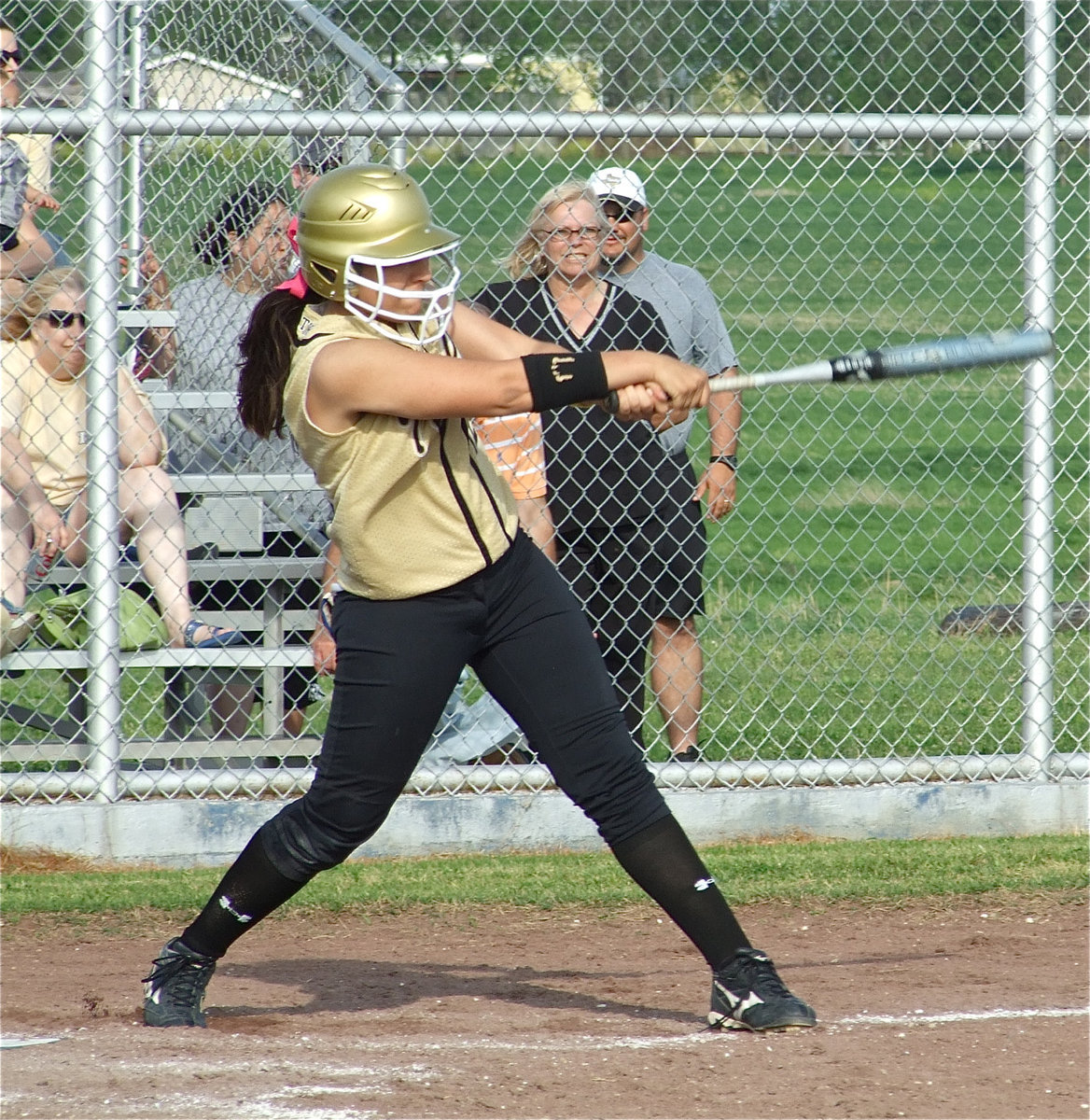 Image: Strong at bat — Alyssa Richards(24) gets all of that one.