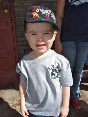 Image: Look at my shirt — Gared Wood sports his new custom printed IYAA shirt he received during the Game On Athletics grand opening.