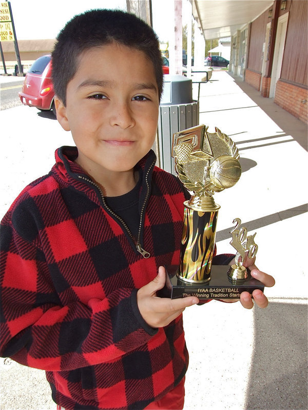 Image: Michael Gonzalez — Michael Gonzalez also received his IYAA trophy during the Game On Athletics grand opening celebration.