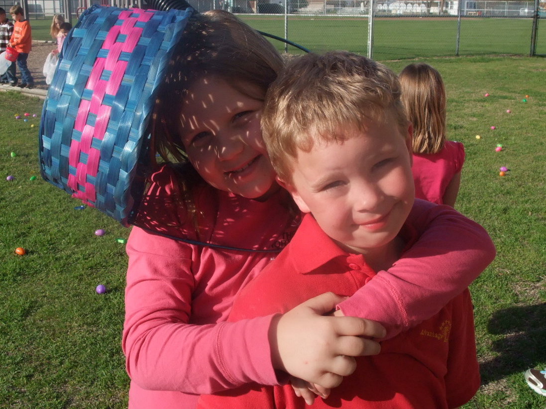 Image: Tatum and Jackson Adams — Tatum (3rd grader) and Jackson (kindergartner) are having fun at the Easter Egg hunt.