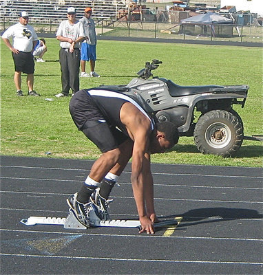 Image: On your mark… — Coach Craig Bales and Coach Stephen Coleman watch De’Andre Sephus get ready to run in a relay event.