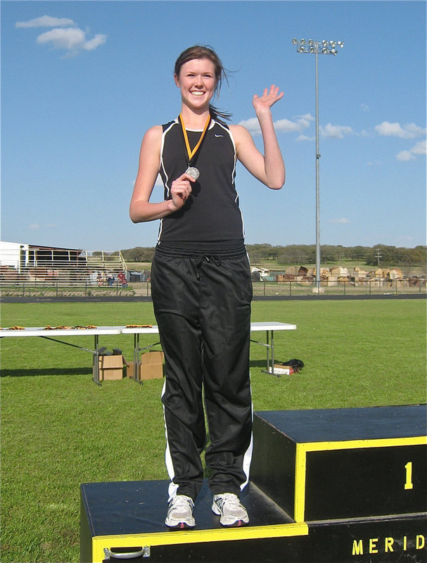 Image: Kaitlyn waves — Kaitlyn Rossa waves from the podium.