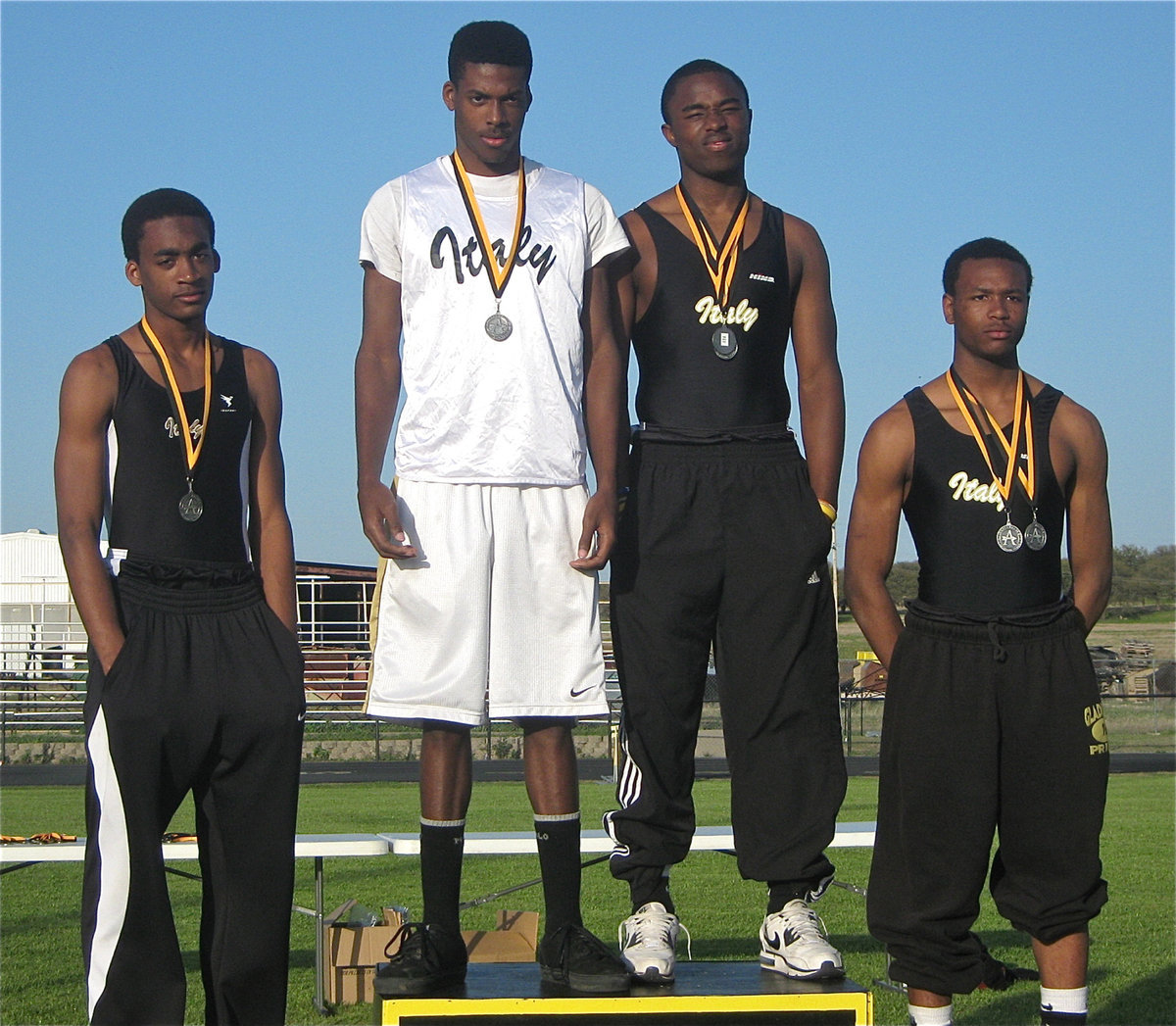 Image: Proud on the podium — Heath Clemons, John Isaac, Jasenio Anderson and De’Andre Sephus get it done in the 4×200, finishing in 3rd Place.