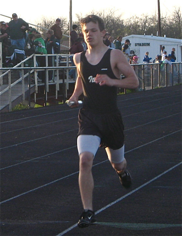 Image: Hamilton keeps going — Chase Hamilton keeps pace during the relay.