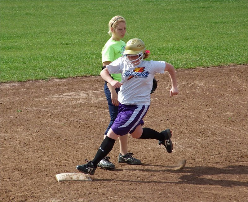 Image: Rounding 3rd — Katie Byers turns the corner at 3rd during situational drills.
