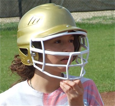 Image: Paola peers out — Paola Mata keeps her eyes on the ball while running the bases.