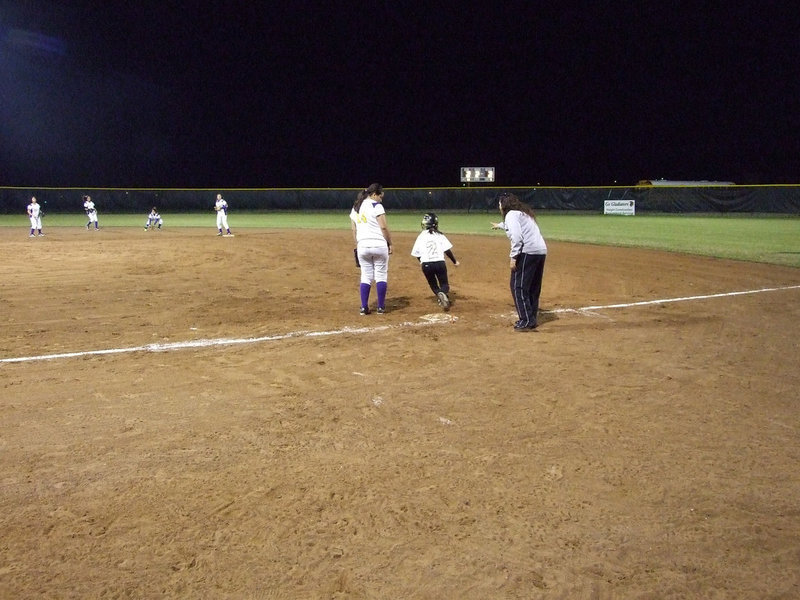 Image: Go, Pita! — Junior Lupita Luna hits one in the air and steals second.