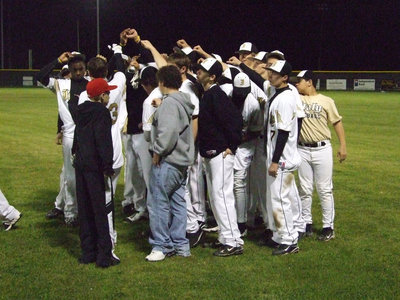 Image: Huddle up — Coach Coker and Ward give the aftergame talk.