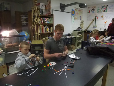Image: Busy Creating — Busy minds and busy hands are seen here getting ready to create their Jitterbug.