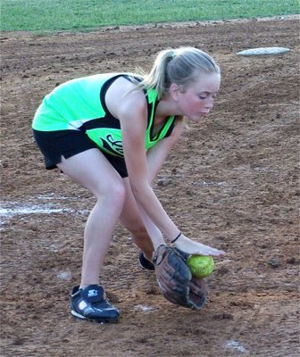 Image: Hannah uses both hands — Hannah Washington uses good technique fielding a grounder for the IYAA 12u girl’s softball team coached by Michael Chambers.