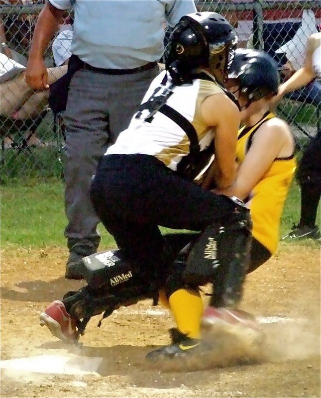 Image: Tate protects plate — IYAA 15u girl’s softball catcher, Mary Tate, makes a stand at the plate and gets a much needed out against Itasca.