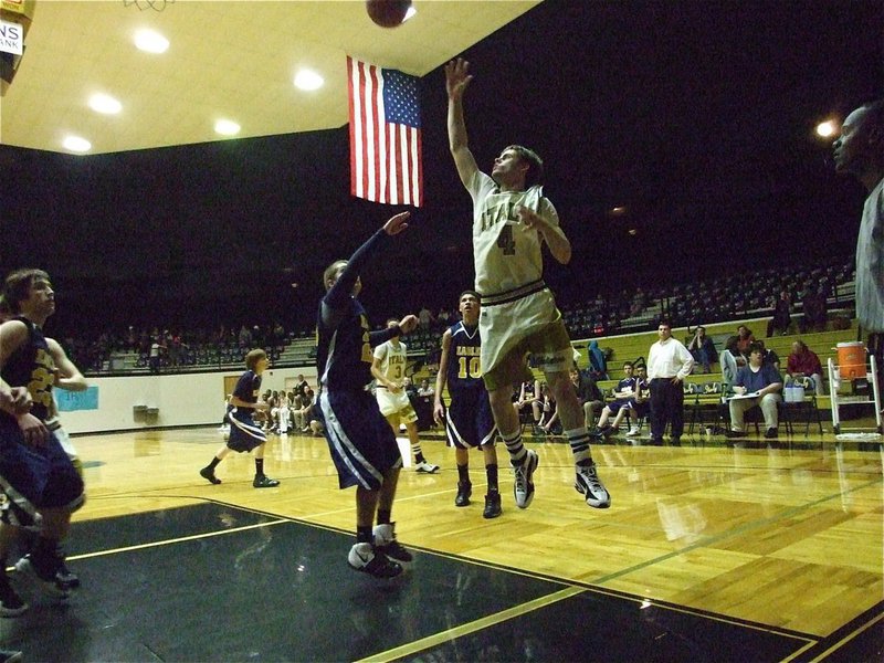 Image: Ashcraft dazzles — These old uniforms look good as new as current Gladiator Ryan Ashcraft(4) scores inside.
