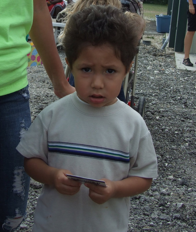 Image: I wasn’t expecting a card — Fernando won a grand prize of a $50 Walmart card-where you can buy a big toy and lots more candy.