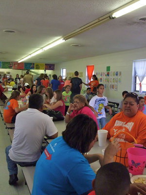 Image: Happy diners — The cafeteria was packed with hungry parents and kids.
