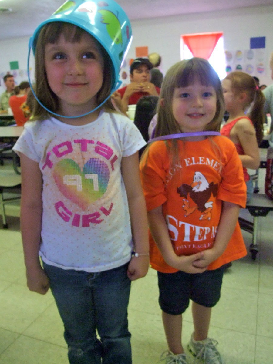 Image: Harley and Ireland Sutton — These two little girls got tired of carrying their buckets so they put them on their heads.