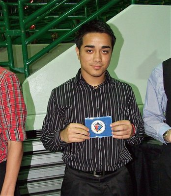 Image: Rolando Vega — Milford Bulldog football star, Rolando Vega, displays his Victory Bowl medal after being recognized during the FCA All-Star Victory Banquet in Waco.