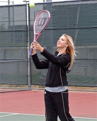 Image: Warming up — Sierra Harris takes a few practice serves.