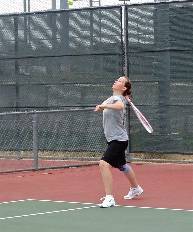 Image: Elevated her game — Lisa Olschewsky uses her new and improved serve to win her opening set 6-4.