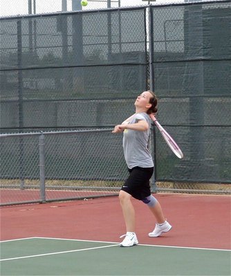 Image: Elevated her game — Lisa Olschewsky uses her new and improved serve to win her opening set 6-4.