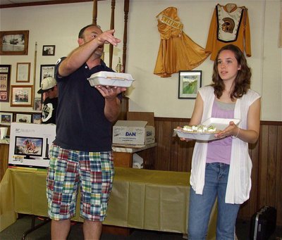 Image: Do I hear, $30? — Doug Nelson acts as auctioneer and Melissa Smithey does her best Vanna White impersonation.