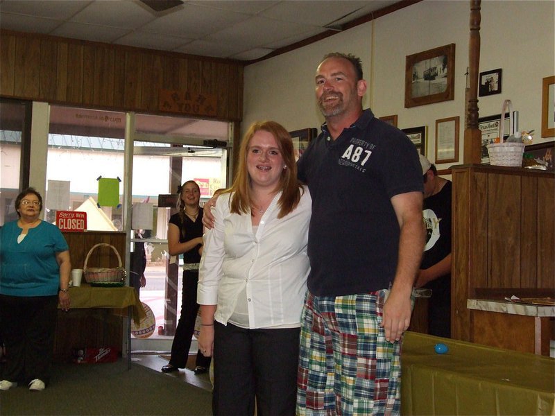 Image: Emily’s birthday — Doug Nelson leads the Uptown Cafe audience in singing, “Happy Birthday,” to 15 year old Emily Stiles who is a member of the Gladiator Regiment Band.