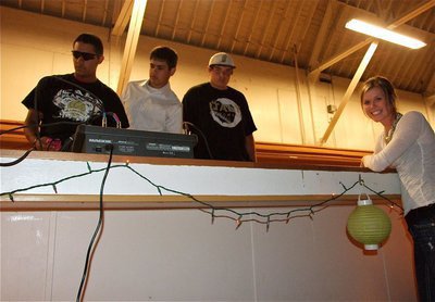 Image: At the dance — Michael “Taz” Martinez, Reid Jacinto and Kevin Roldan keep the music flowing inside the old Italy gym while, Kaitlyn Rossa, puts in a song request.