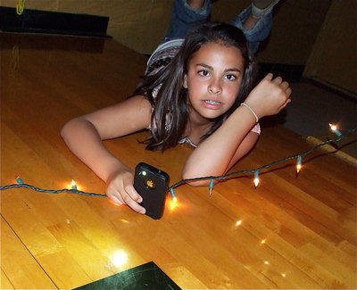 Image: Light moment — Ashlyn Jacinto takes a timeout from the dancing.