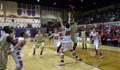 Image: Larry Mayberry — Italy’s Larry Mayberry(13) spins and shoots in the lane.