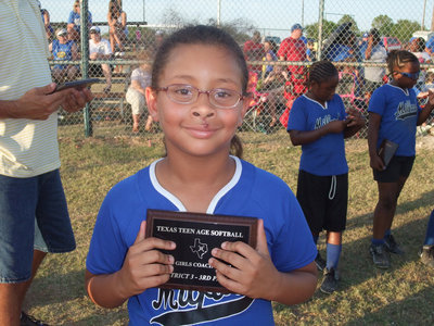 Image: Hannah was tough — Hannah Gates takes home a plaque and a scrape.