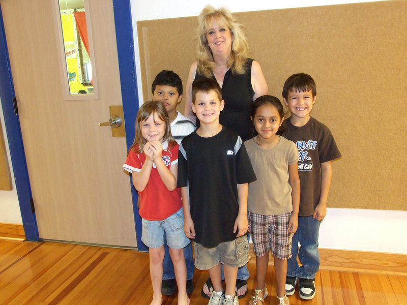 Image: Miss Nelson and Class — Avalon ISD has a very strong summer school program with fifty students enrolled this year. Miss Nelson is working in the summer school program and these are her first grade reading students.