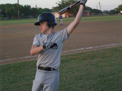 Image: Practice swing — Timing his swing with the Covington picther, while in the batter’s box, is Justin Wood.