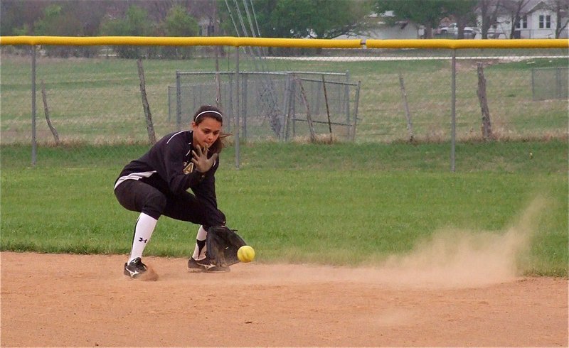 Image: On the ball — Shortstop, Anna Viers, collects a ball during warmups between innings in Clifton.