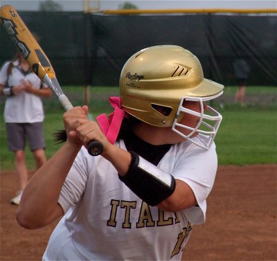 Image: Nikki unleashes — Nikki Brashear prepares to swing at a fast ball against Whitney.