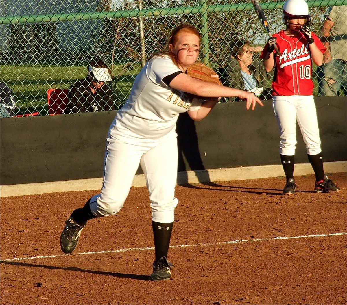 Image: Determined to win — Third baseman, Katie Byers, has “the look” as she warms up on defense. On offense, Byers batted a thousand against the Lady Longhorns hitting all four times she held a bat in her hands.