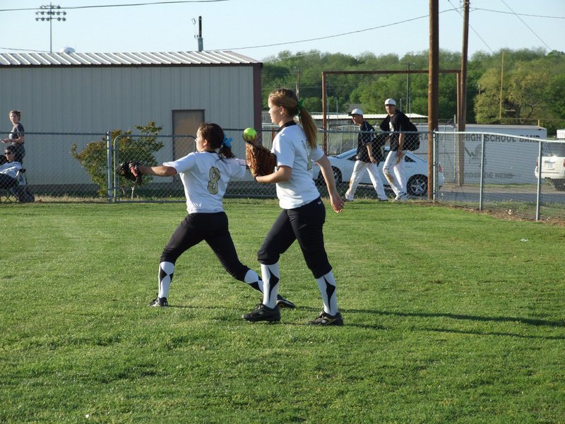 Image: Hustle play — Centerfielder, Paige Westbrook(10), hustles over to left field to back up teammate, Morgan Cockerham, during their game against Grandview.