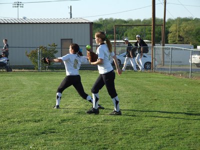 Image: Hustle play — Centerfielder, Paige Westbrook(10), hustles over to left field to back up teammate, Morgan Cockerham, during their game against Grandview.