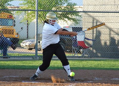Image: Hanging tough — Senior slugger, Nikki Brashear, gets a piece of a pitch in Grandview.