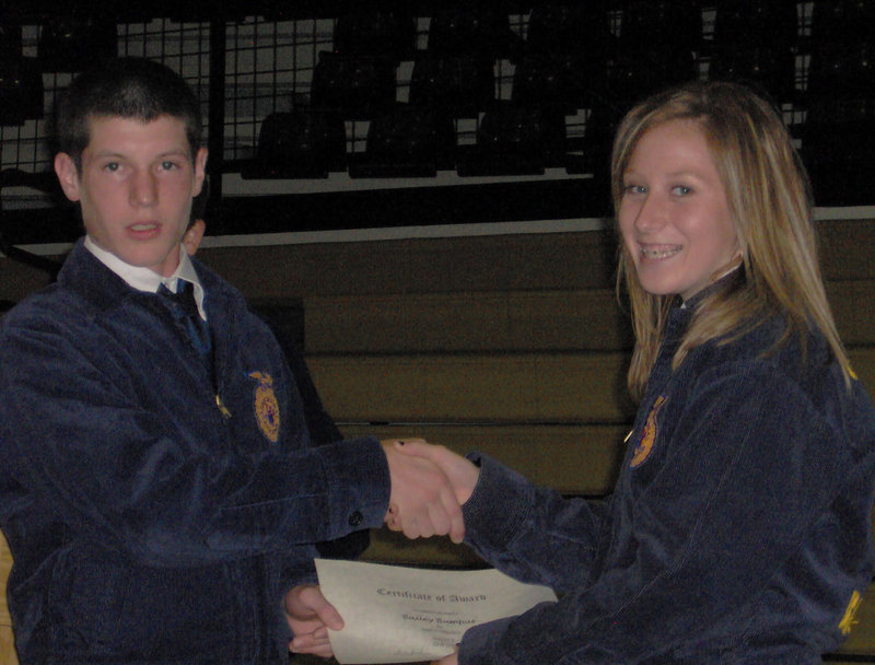 Image: Congratulations Bailey — Matt Crownover congratulates Bailey Bumpus for a job well done.
