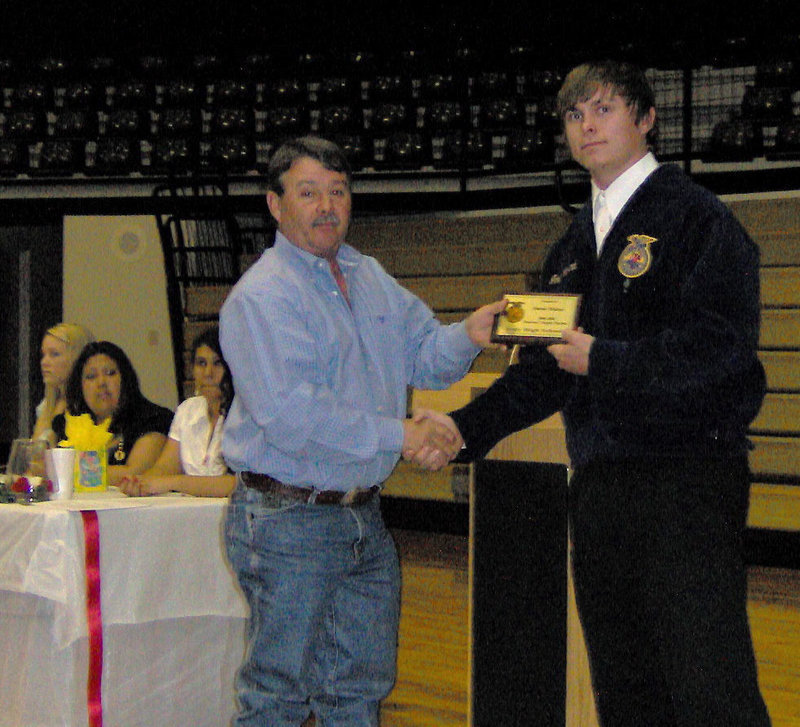 Image: Larry Eubank and Trent Morgan — Trent Morgan presents the Honorary Chapter Farmer Degree to Larry Eubank on behalf of Italy ISD Superintendent Jimmie Malone.