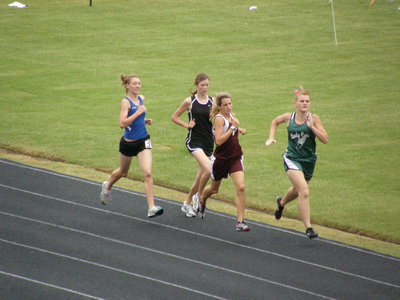 Image: In the pack — Kaitlyn Rossa tries to find some space during her 1600 meter event. Rossa improved on her personal best time by 17 seconds.