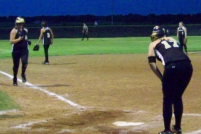 Image: Joggin’ in — Jeffords takes her homerun lap with Richards waiting to congratulate her.