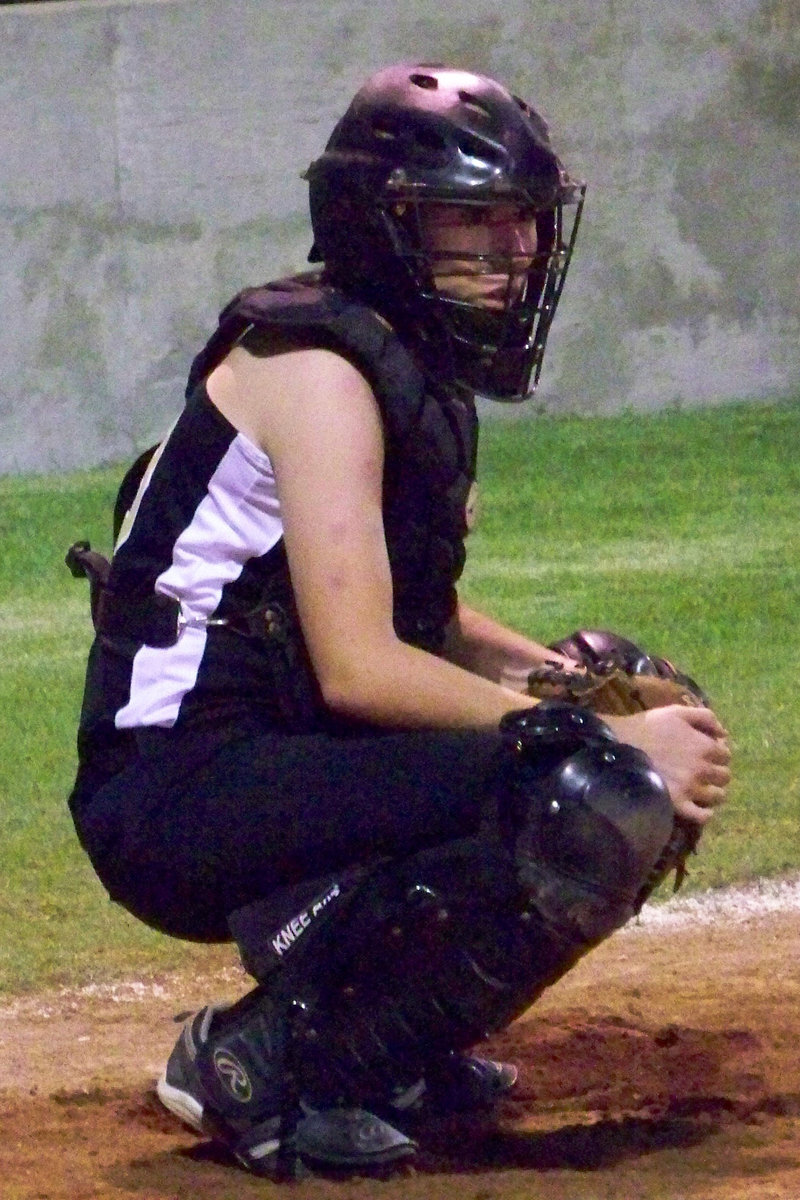 Image: “Bump” — Bumpus takes the pitch signal from Coach Reeves.