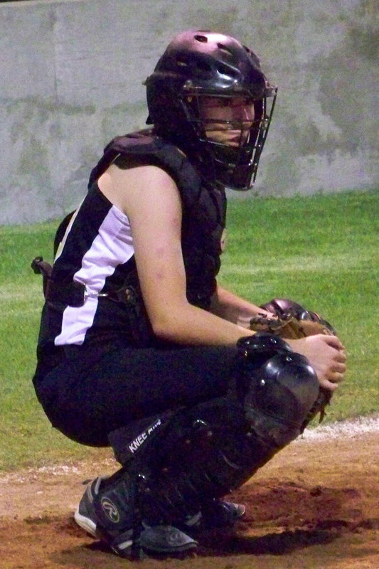 Image: “Bump” — Bumpus takes the pitch signal from Coach Reeves.