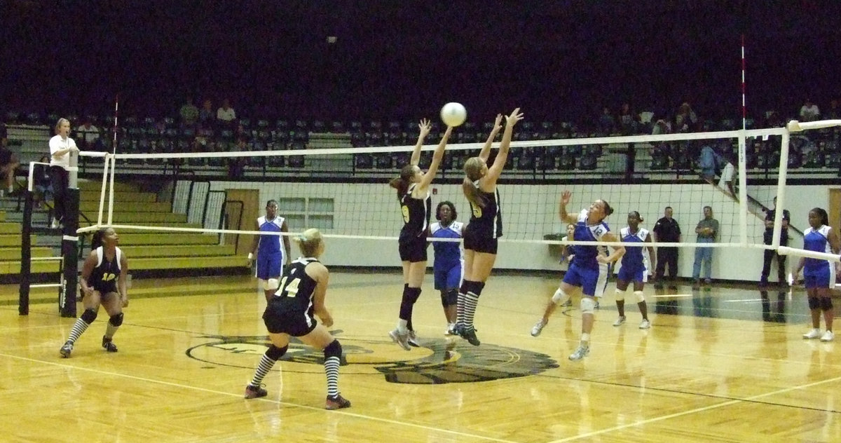 Image: Frontline jumps — Milford hits the ball over the net to the frontline.