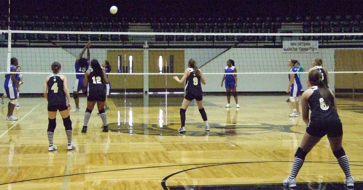 Image: Hit over the head — Milford player hits over the head for a point.