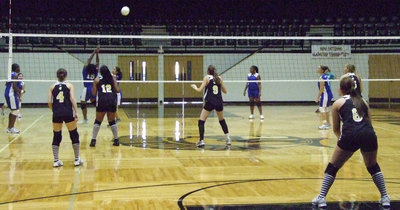 Image: Hit over the head — Milford player hits over the head for a point.