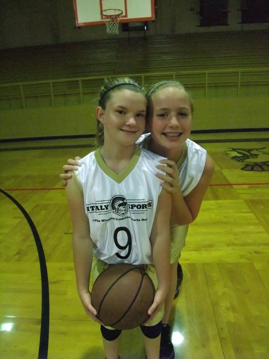 Image: Having a ball — Tara Wallis and her shy teammate Maddy Washington have some fun before their final home game.