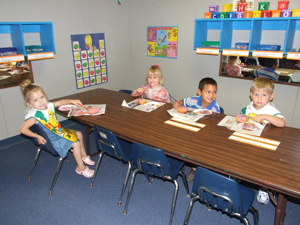 Image: Three and four year olds. - These cute pumpkin painters are part of the three and four-year-old class.
