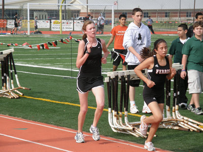Image: Rossa vs the rabbit — Stalking her prey, Kaitlyn Rossa waited until the final leg to kick past this rabbit-like, Ferris runner and take the gold medal.